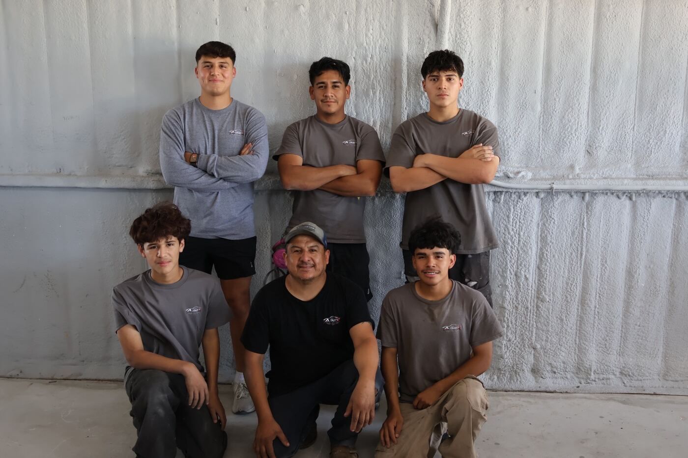 The Apex Auto Collision crew in shop shirts